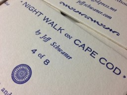 Close up of the back of the coaster. The title is in Copperplate Gothic.