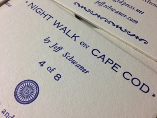 Close up of the back of the coaster. The title is in Copperplate Gothic.